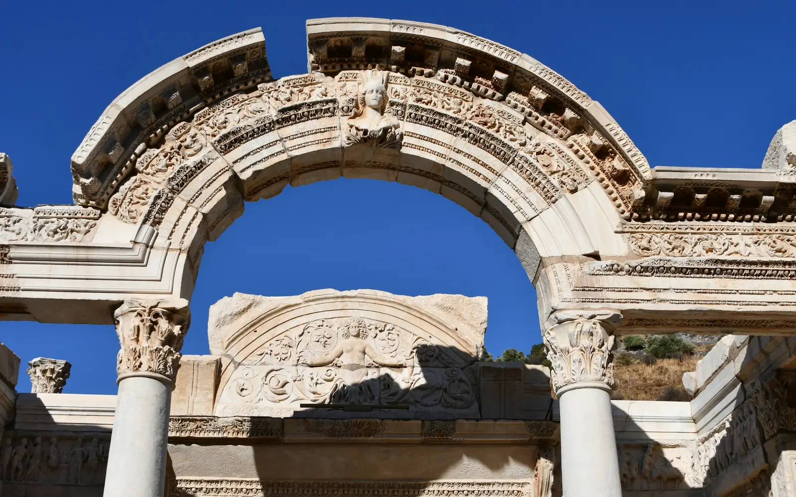 The carved arch of the Temple of Hadrian on Curetes Street