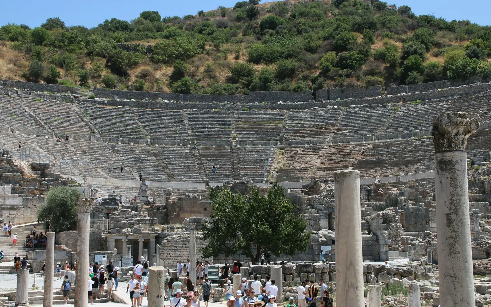 The stone tiers of the Great Theatre of Ephesus curving around the orchestra